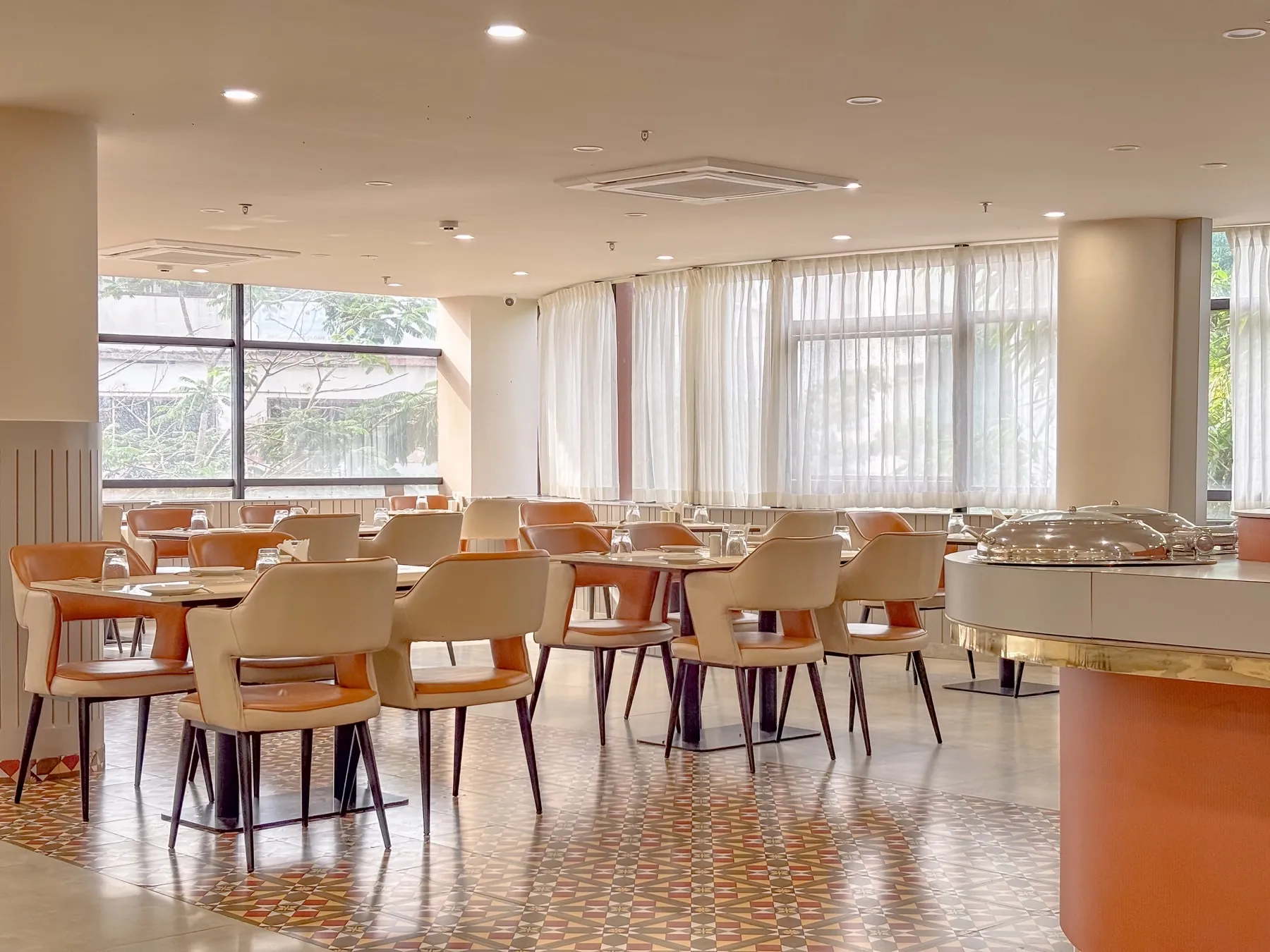 Set dining tables at Hotel Explora Calicut