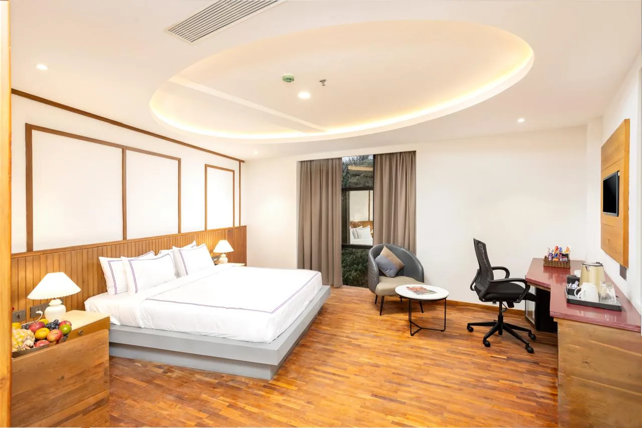 Deluxe room at Hotel Explora Kerala with modern amenities